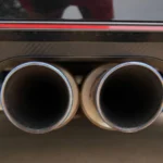Detailed view of dual exhaust pipes on a sports car, emphasizing power and design — SSK Mechanics guide to What Is an O2 (Lambda) Sensor and What Does It Do