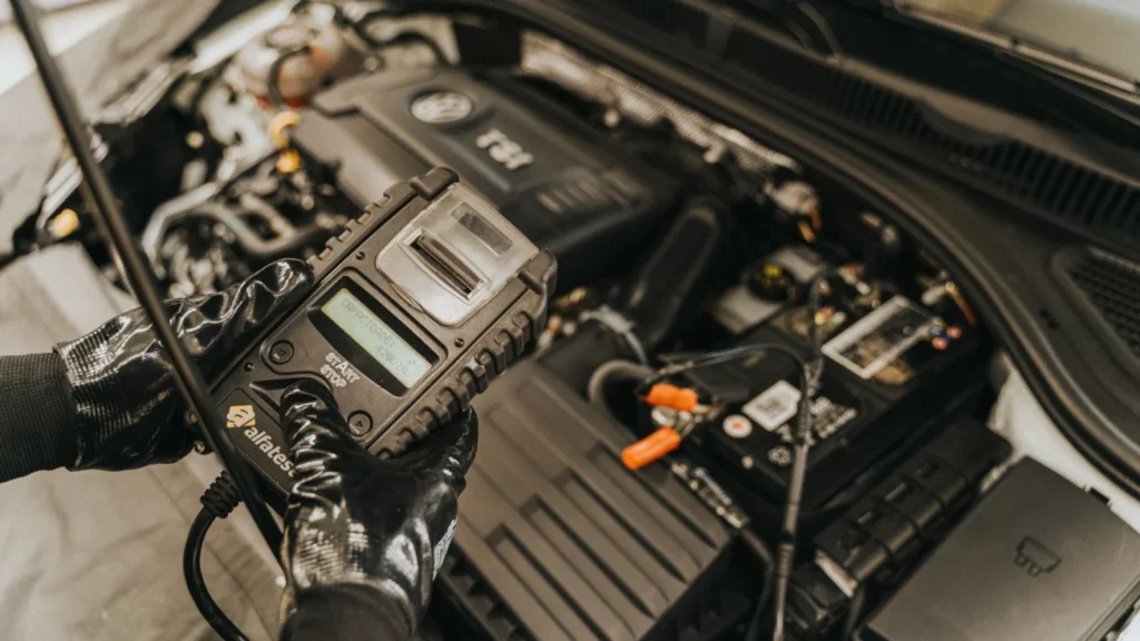 Mechanic diagnosing a car engine with a diagnostic tool, showcasing technical expertise and… — SSK Mechanics guide to Screeching Noise From Your Car: What It Usually Means