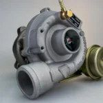 A turbocharger and boost control solenoid in a car engine bay