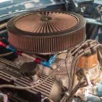 Mechanic checking a van engine bay against a service checklist